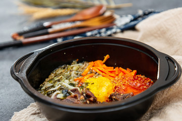 Bibimbap Rice, vegetables, minced marinated beef, spicy sauce and egg yolk