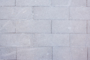 Detail of a wall with gray bricks. Useful for textures and patterns.