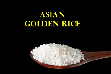 isolated rice in wooden spoon on black background