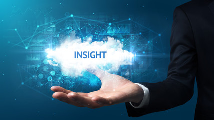 Hand of Businessman holding INSIGHT inscription, successful business concept