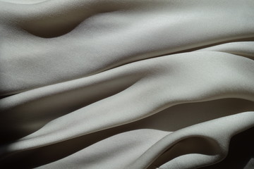 Soft folds on light grey chiffon fabric