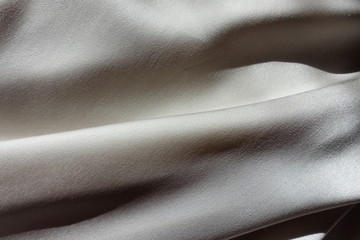 Smooth light grey chiffon fabric in soft folds