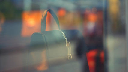 Women's bag at the window in the evening