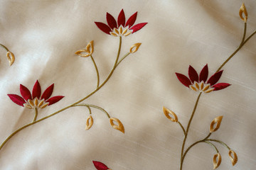 Cream white cloth with floral embroidery from above