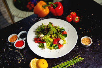lettuce salad with white cheese, cucumber and tomato