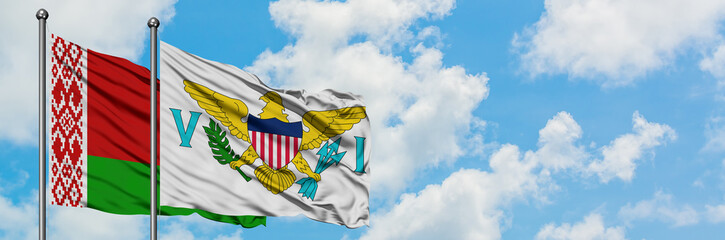Belarus and United States Virgin Islands flag waving in the wind against white cloudy blue sky together. Diplomacy concept, international relations.