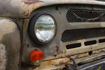 Headlight of an old Soviet military vehicle. Car detail. Close-up