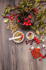 Halloween concept background. Witch bowler, mistletoe, elderberry. Dry herbs, flowers, fresh berries