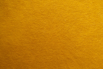 Background - amber yellow woolen knitted fabric