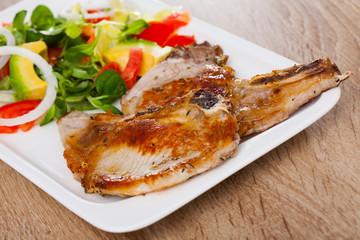 Pork chops with vegetable salad