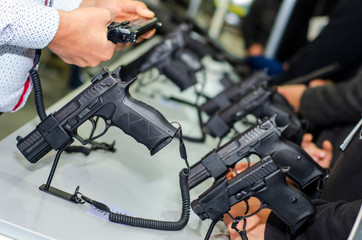 Gun Display Stands. Pistols for sale in the store.