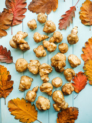 Fototapeta premium Jerusalem artichoke on wood