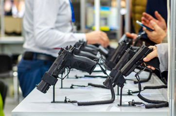 Gun Display Stands. Pistols for sale in the store.