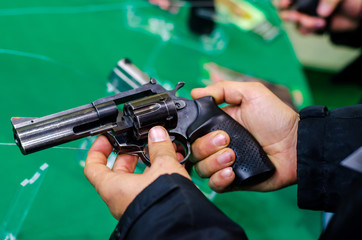 Man using revolver. Revolver for sale in the store.