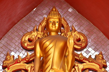 Golden Buddha statue at a Thai Buddhist temple