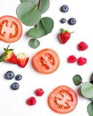 Mixed berries strawberry blueberry raspberry tomato  flat lay photo shooting on clean white background