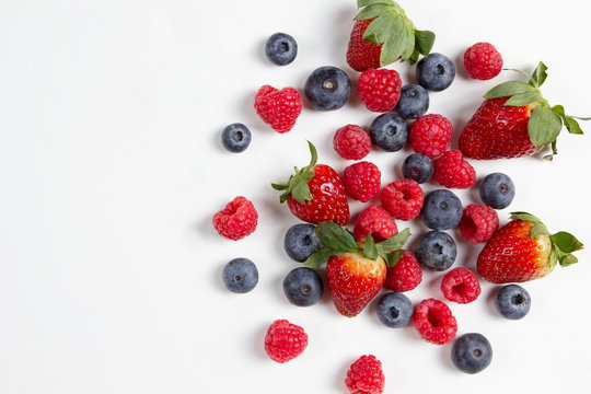 Mixed Berries Strawberry Blueberry Raspberry Tomato  Flat Lay Photo Shooting On Clean White Background