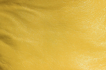 Blurred leather background, ocher color. Abstract texture background out of focus. Abstract...