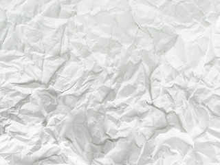 Crumpled white paper is old background. Blank white wrinkled paper sheet. Empty space.