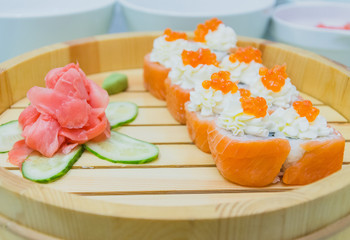 portion of sushi on wooden plate