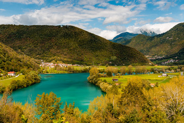 Fototapeta na wymiar Picturesque Most Na Soci Lake and Village in Slovenia at Fall