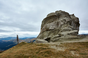 Peak Baba Mare, stone in the Bucegi Natural Park in Romania. Megaliths on top of a mountain range, tourist attraction.
