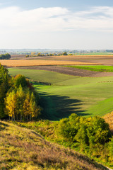 Fototapeta na wymiar Rolling Hills in Polish Coutryside with Farm Fields at Fall Season