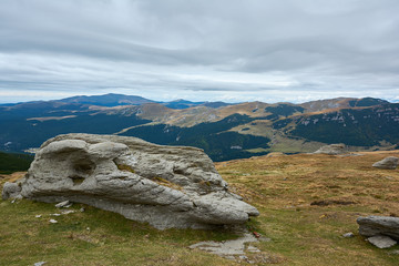 Mountain landscape in Bucegi Natural Park near Busteni, Romania. Megaliths on top of a mountain range, tourist attraction.