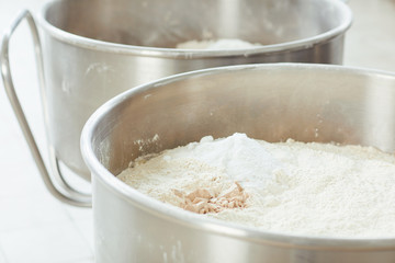 Fototapeta na wymiar Ingredients for making dough for baking bread and baking.