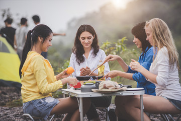 Camping concept - Group of happy friends doing outdoor activities.