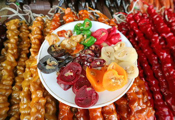 Traditional Georgian Sweets Called Churchkhela or Churchela, Candle Shaped Grape Juice Candy with Nuts Inside 