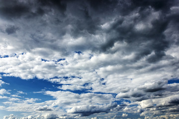 in the blue sky clouds and the sun.