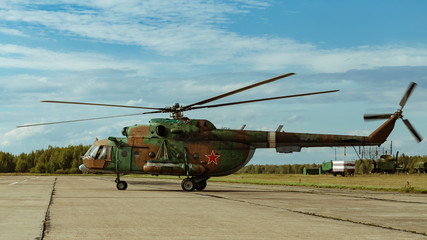 Naklejka na ściany i meble Military helicopter at the airport