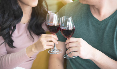 Lovers, men and women, drink prosecco happily, make a warm and happy family to celebrate Christmas near the new year.
