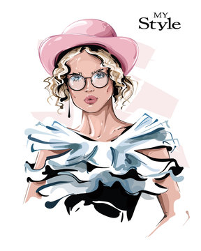 Hand drawn beautiful young woman in pink hat. Stylish girl in eyeglasses. Fashion woman look. Sketch. Vector illustration.