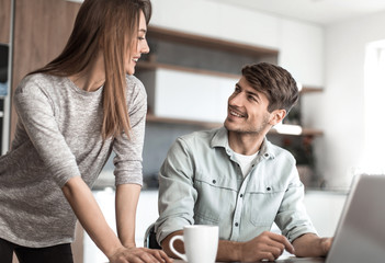 close up. Young couple looking at laptop screen