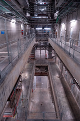 Obraz premium View of the plant from the outside, pipes smoke, wind turbines in the sea, barrels, tanks, thermal power plant, modern, technological waste processing plant, garbage processing plant