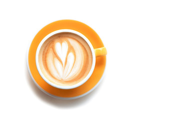 Cappuccino with frothy foam, yellow coffee cup top view closeup isolated on white background. Flat...