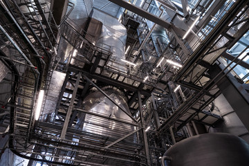 View of the plant from the outside, pipes smoke, wind turbines in the sea, barrels, tanks, thermal power plant, modern, technological waste processing plant, garbage processing plant