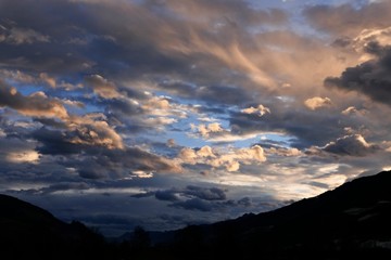 beautiful morning sky in the mountains with orange clouds