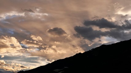 beautiful morning sky in the mountains with orange clouds