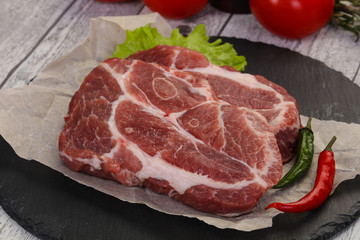 Raw pork neck steak