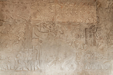 Fototapeta na wymiar Scene of the Churning of the Milk Ocean carvings status on the wall of Angkor wat temple, world heritage, Siemreap, Cambodia
