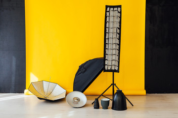 flash and accessories photo studio on a yellow background