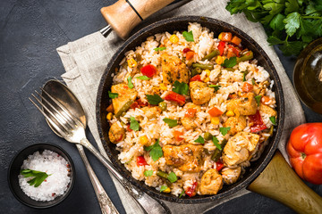 Fototapeta Rice with chicken and vegetables top view. obraz