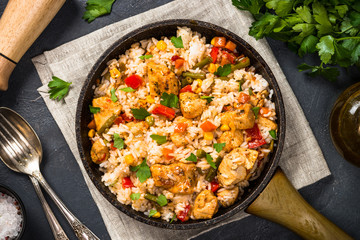 Obraz na płótnie Canvas Rice with chicken and vegetables top view.