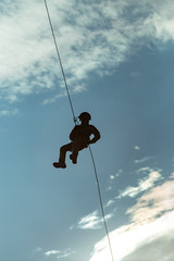 Landing of special forces on a rope from a helicopter	