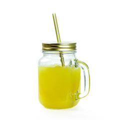 Glass jar mug with orange juice. Close up. Isolated on white background