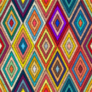 Embroidered geometric seamless pattern. Handmade in bohemian style. Patchwork hand-drawn ornament. Pricn for textiles, wrappers, carpets. Ethnic and tribal motifs. Vector illustration.