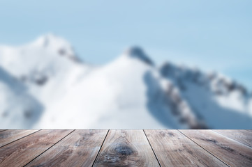 Beige wooden planks with blurred natural background